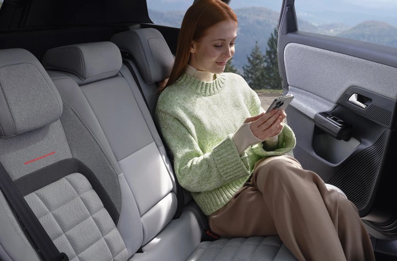 woman sat in the rear seats of a car