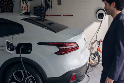 man chargering car in the garage