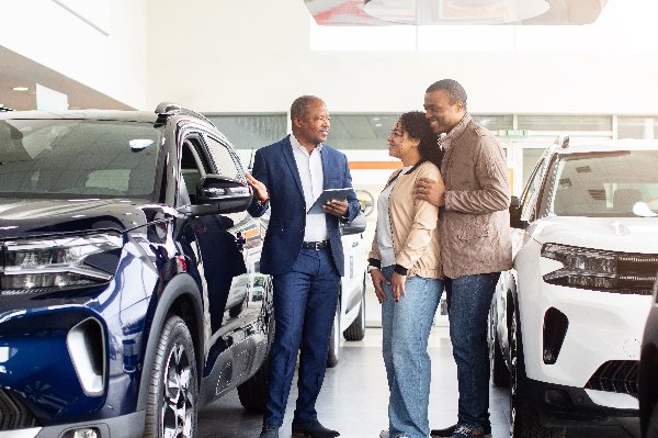 Couple looking at cars