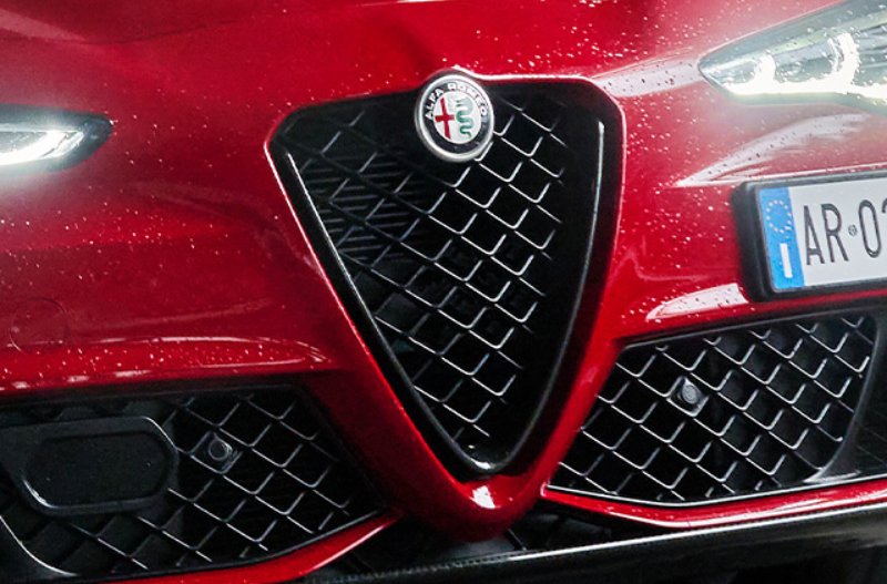 close up shot of the front grille of a ca r
