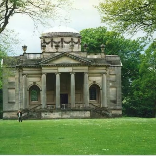 Whickham garage landmark in Gibside Gardens surrounded by trees.