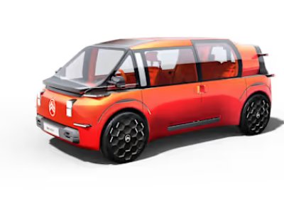 Orange futuristic Citroën ELO concept car with glass panels and black wheels, viewed from an angle.