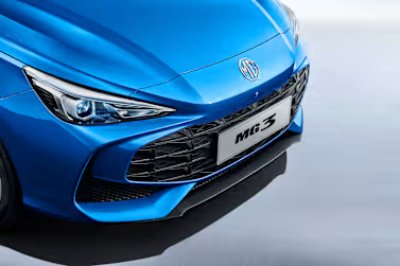 Front view of blue MG 3 car showing headlight and grille.