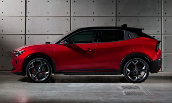 car parked side view against concrete wall