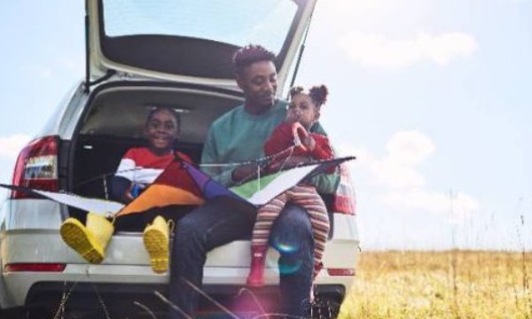 people sat in the boot of the car