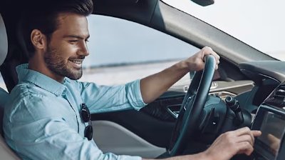 man sat in a car