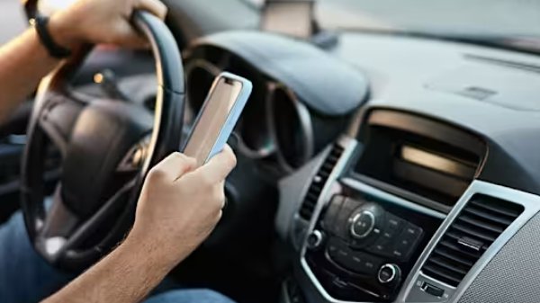 person on the phone in the car