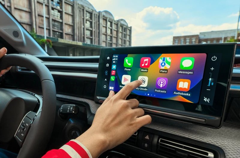 finger touching the screen in the car
