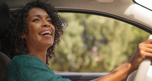 woman in the driver seat of the car