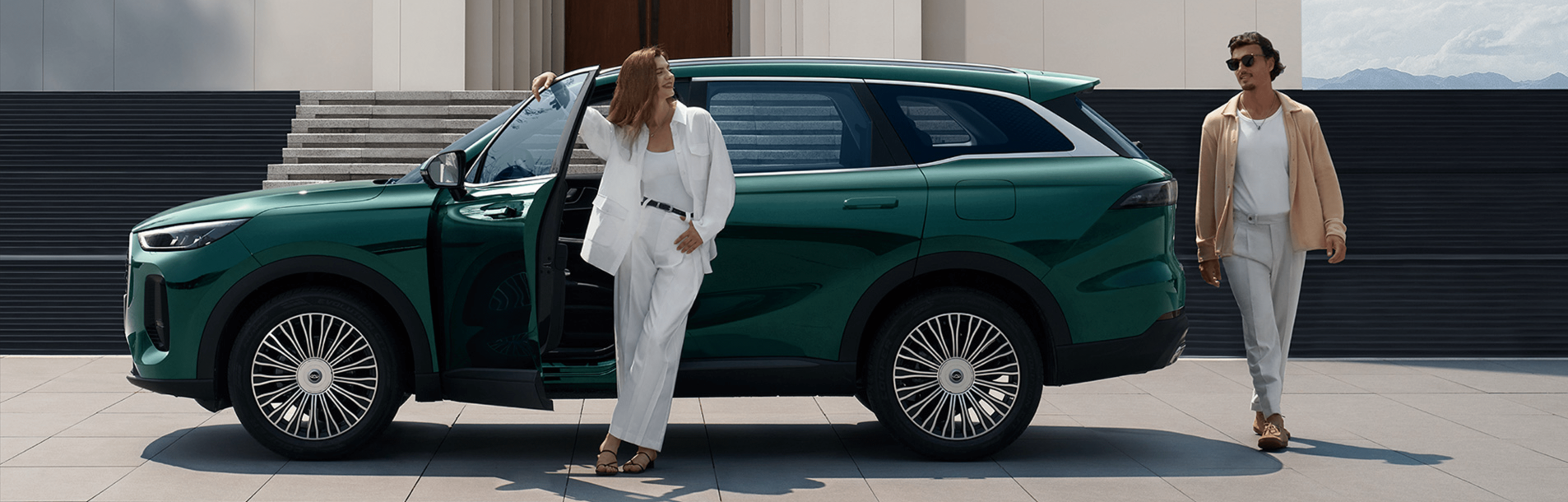 two people talking outside of the car